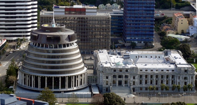 Aerial view of the Beehive and New Zealand Parliament building, with surrounding buildings.