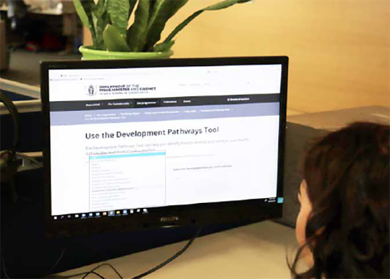 Land Information New Zealand case study - photo of a person accessing the development pathways tool online Land Information New Zealand case study
